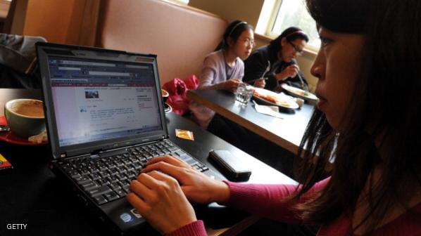 A woman views the Chinese social media w