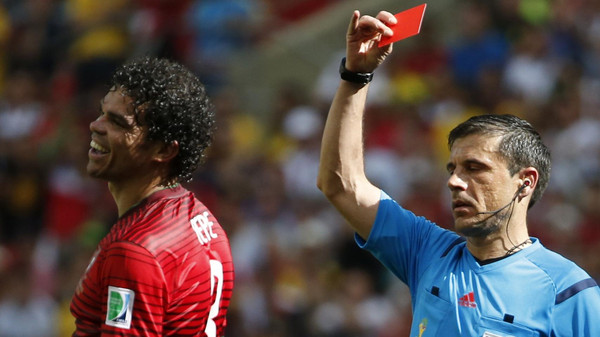 Portugal's Pepe is shown the red card by referee Mazic of for committing a rough foul against Germany's Thomas Mueller (not pictured) during their 2014 World Cup Group G soccer match at the Fonte Nova arena in Salvador
