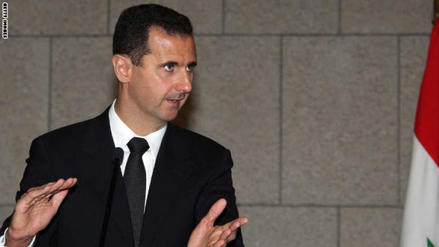 Syrian President Bashar al-Assad gesture
