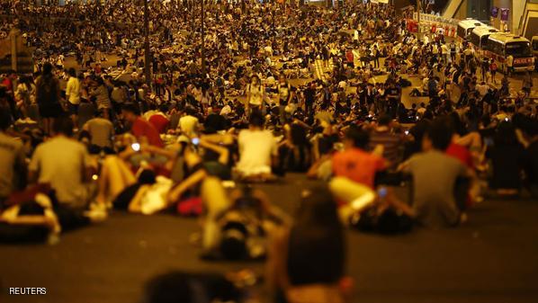 Protesters block the main street to the financial Central district outside the government headquarters in Hong Kong