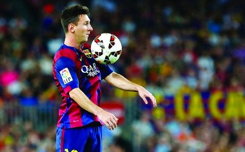Barcelona's Messi controls the ball during the Spanish first division soccer match against Elche at Nou Camp stadium in Barcelona