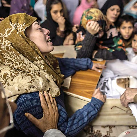 A mother mourns her son Mohammed Ali Khan, a student who was killed during an attack by Taliban gunmen on the Army Public School, at her house in Peshawar