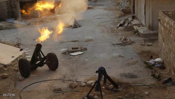 Locally made shells are launched by Free Syrian Army fighters towards forces loyal to Syria's President Bashar al-Assad in the Handarat area, north of Aleppo