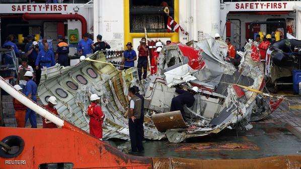 Section of the tail of AirAsia QZ8501 passenger plane is seen on the deck of the ship Crest Onyx, the day after it was lifted from the seabed, as it arrives at Kumai Port, near Pangkalan Bun