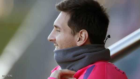 Barcelona's Messi smiles during a training session at Joan Gamper training camp, near Barcelona