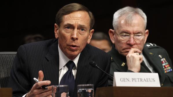 CIA Director David Petraeus (L) speaks to members of a Senate (Select) Intelligence hearing on "World Wide Threats" on Capitol Hill in Washington