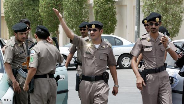 Saudi security personnel gather outside