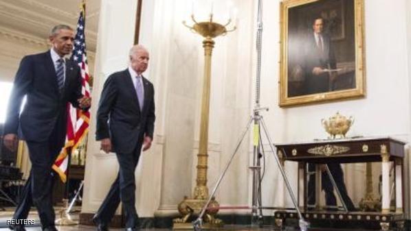 Obama and Biden walk together after Obama announced that the United States, with five other major world powers, and Iran have reached a nuclear deal