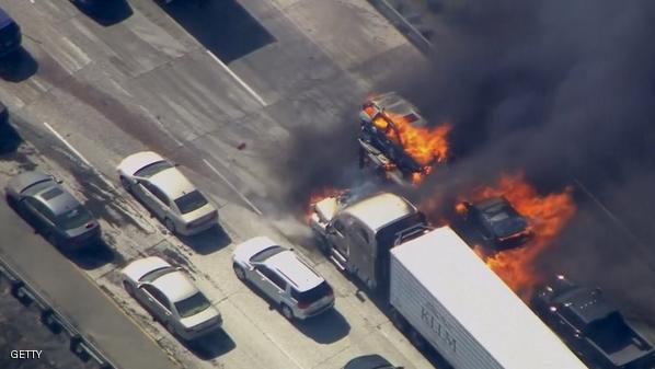 Frame grab from video of cars burning on Interstate 15 during a brush fire in the Cajon Pass, California