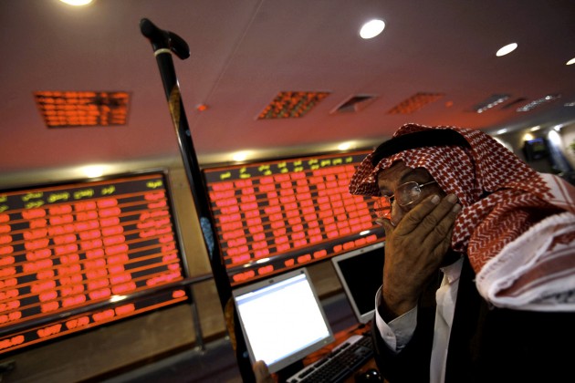 A Qatari investor follows the stock mark